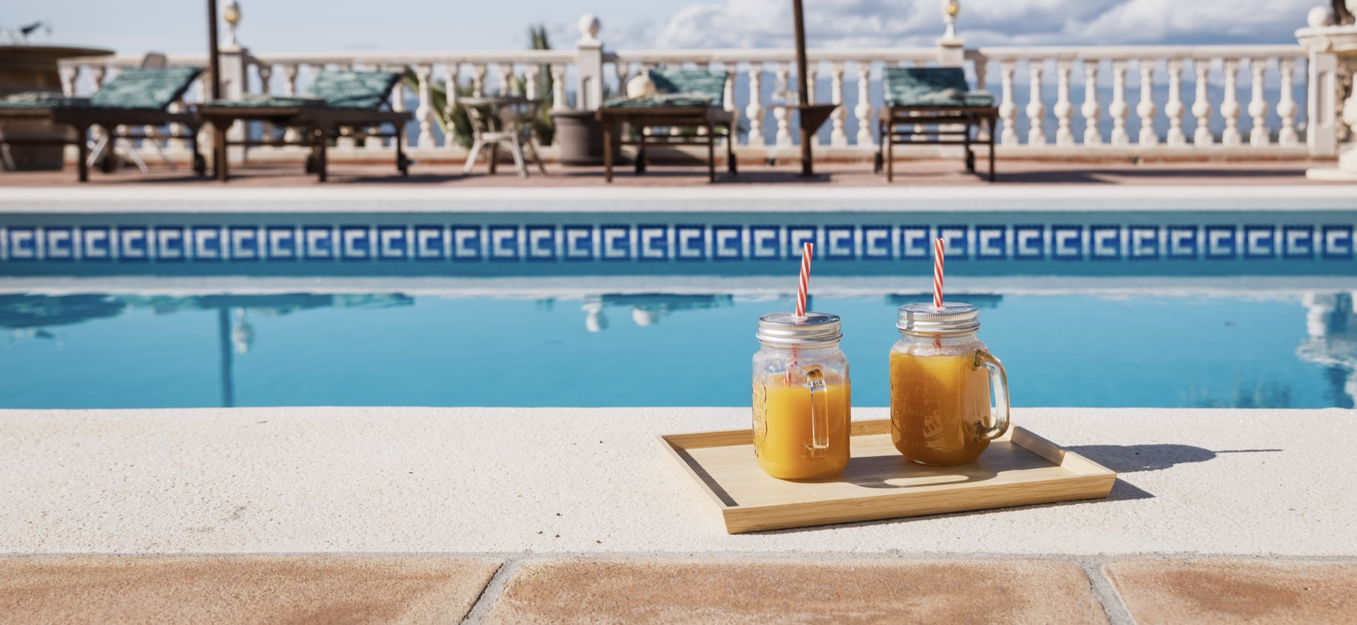 Fresh juice by the pool at a Holidays Malaga villa on the Costa del Sol
